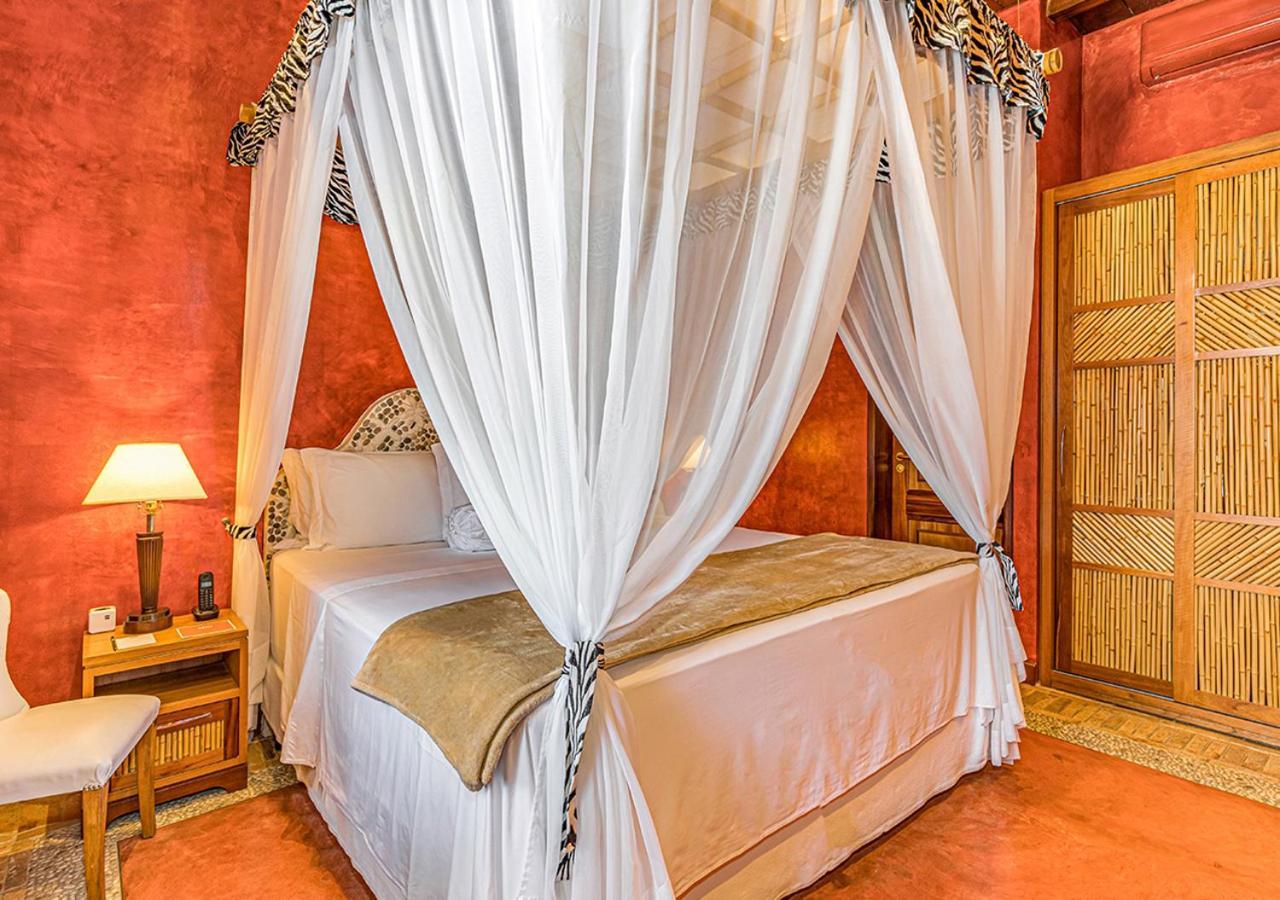 Dpny Beach Hotel & Spa Ильябела Экстерьер фото A bed with a mosquito net